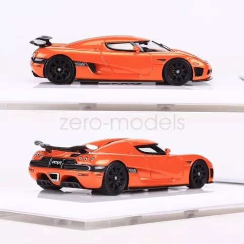 1:64 scale orange racing sports car model, side profile on display