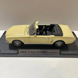 1964 1/2 Ford Mustang convertible diecast car, light yellow with black interior