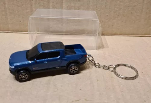 Blue diecast pickup truck keychain with metal key ring and chain