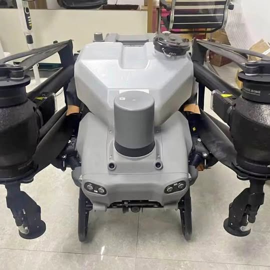 DJI T50 quadcopter drone in white, front view with four arms and propellers