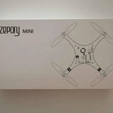 Mini drone box with illustrated quadcopter drone and button controls diagram