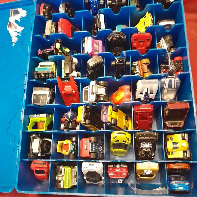 Assorted Matchboxdifferent diecast cars in blue storage tray