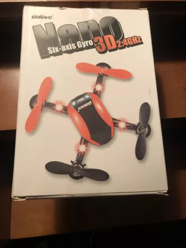 Red quadcopter drone with four propellers shown on retail product box