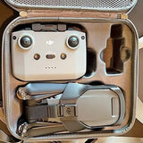 DJI Mavic 3 drone in open gray carrying case, front camera module visible