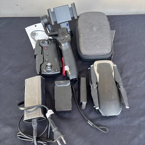 DJI Mavic drone accessories kit with remote, batteries, cables, and gray carrying case