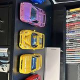 Diecast cars set with purple and yellow miniature cars in tray