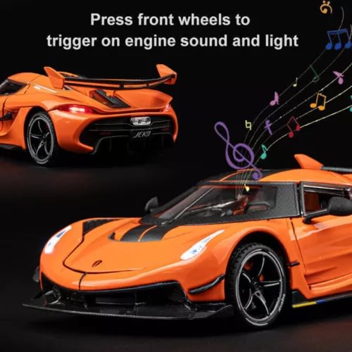 Orange 1:24 scale diecast sports car model with open doors, front view.