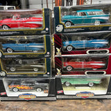 Diecast car display set in boxes, Chevrolet and American Muscle models in red, blue, green