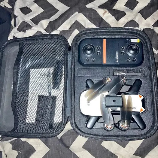 Compact drone kit in navy hard case with mesh pocket and foldable quadcopter
