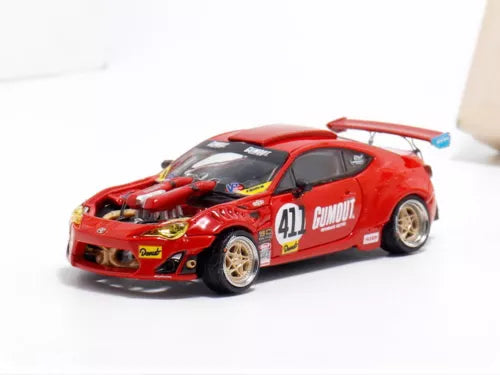 Red 1/64 scale Toyota GT4586 diecast model car with hood detailing