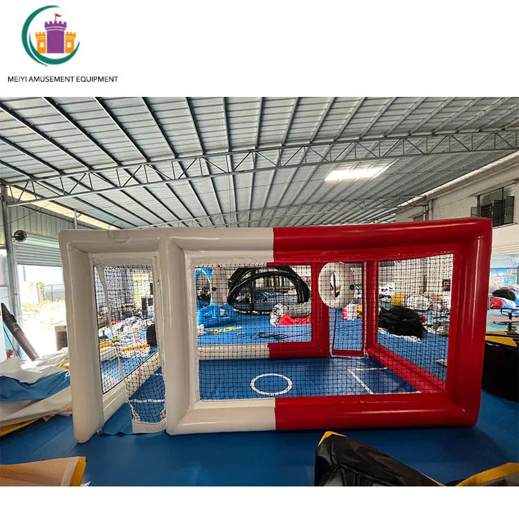 Inflatable soccer training arena tent with red and white frame, blue mesh walls and floor