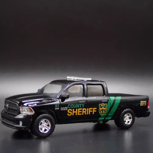 Black 1:64 diecast sheriff pickup truck with yellow lettering and green stripe