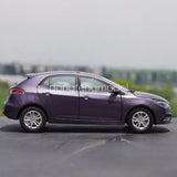 1/18 scale diecast hatchback car, purple with silver wheels, side view
