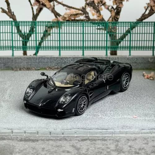 Black 1/64 scale diecast sports car model with front three-quarter view