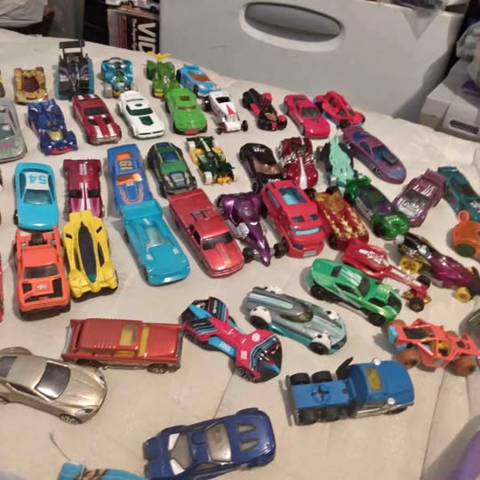 Diecast toy car lot of assorted small cars and trucks, varied colors and styles