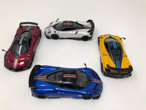 Diecast toy car 4-pack with red, white, blue, and yellow race car models