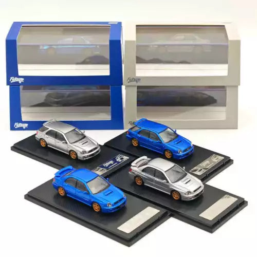 Diecast toy car models set with four Subaru-style cars in blue and silver