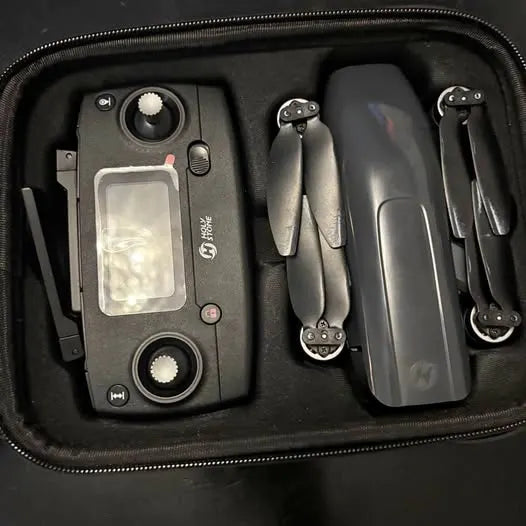 Drone kit in hard case with controller screen and folding propeller arms