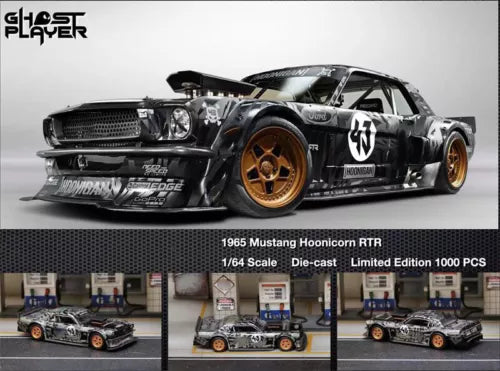 Black 1965 Mustang RTR die-cast model car with orange wheels, front 3/4 view, 1/64 scale
