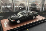 Black and silver 1:64 Ford Crown Victoria diecast car model, side view
