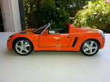 1:18 diecast Opel Speedster model car in orange with black details