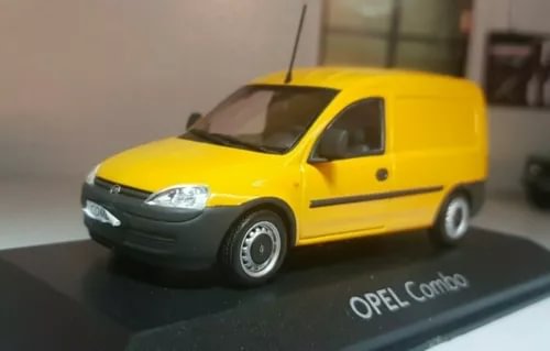 Yellow Opel Combo diecast van scale model with silver grille and wheels