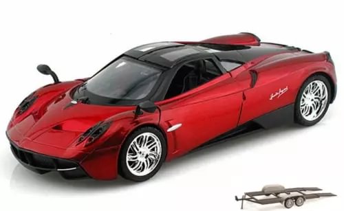 Red diecast sports car with black spoiler, chrome wheels; includes small trailer