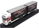 Diecast tractor-trailer model with white cab and black box trailer, 1/76 scale