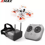 FPV racing drone with white frame and orange propellers, plus gray remote controller