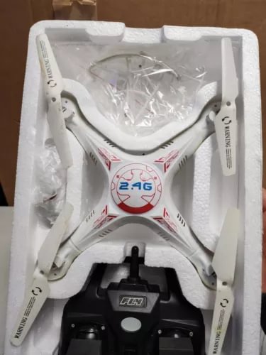 Syma X5 SC 1 quadcopter drone, white body, in retail box with prop guards
