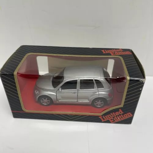 Silver diecast car model in retail box with clear window