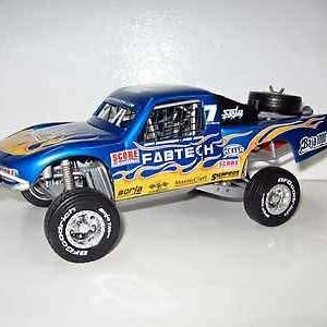 Blue and yellow diecast race car with open wheels and sponsor-style decals