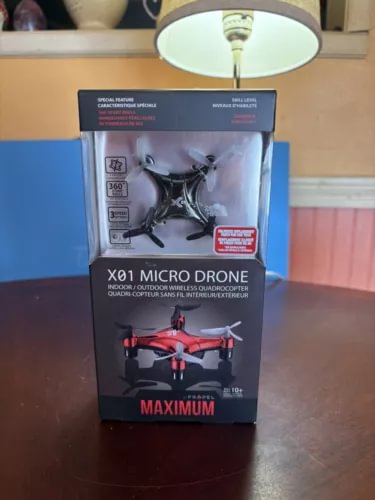 Propel X01 micro drone in retail box with red quadcopter graphic