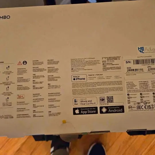 DJI FPV drone retail box with barcode, warnings, and App Store/Android icons
