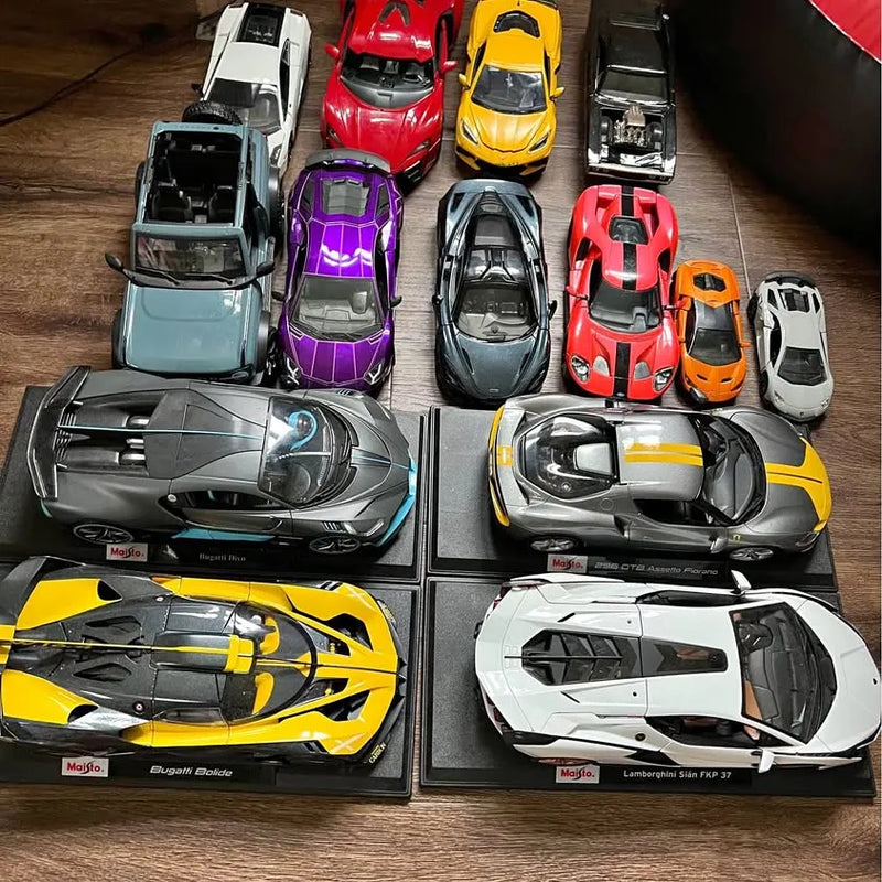 Diecast car collection with assorted color sports cars in individual display trays