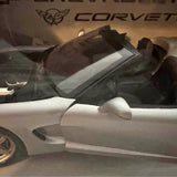 White die-cast Corvette C5 model car, front side view with detailed wheel