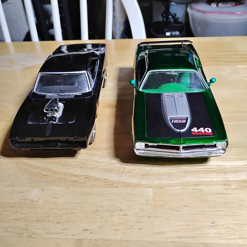 Diecast model cars, green and black Chester SD, detailed hoods and windows