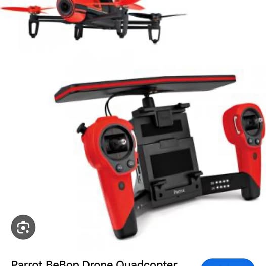 Red and black quadcopter drone with handheld remote controller