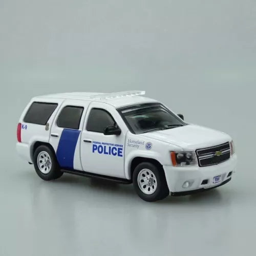 Police SUV diecast model car, white body with blue stripe, front 3/4 view