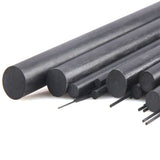 Carbon fiber solid round rods, dark gray, multiple cut ends with thin stems