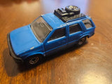 Blue 1994 diecast SUV model with black roof and detailing