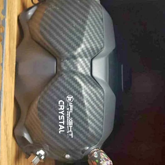 DJI drone goggles shell with carbon-fiber pattern, dark gray, front faceplate