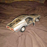 Silver Mustang 500 Shelby diecast car model, rear three-quarter view, detailed wheels