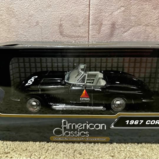 Black and silver die-cast convertible car with CTGT plate