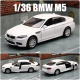 1:36 BMW M5 F10 diecast sedan model car, white, front 3/4 view