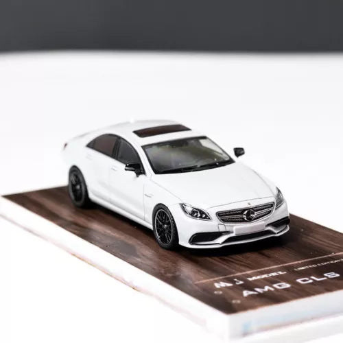 1/64 scale white diecast Mercedes-Benz CLS 63 AMG car model, front 3/4 view