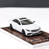 1/64 scale white diecast Mercedes-Benz CLS 63 AMG car model, front 3/4 view
