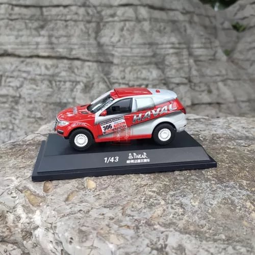 1/43 diecast racer model car in red and white, on black display base