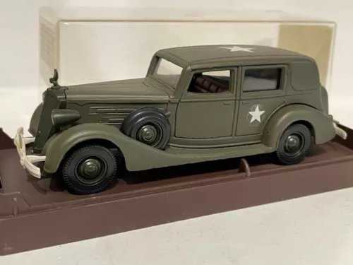 Olive green military diecast car model with white star on door