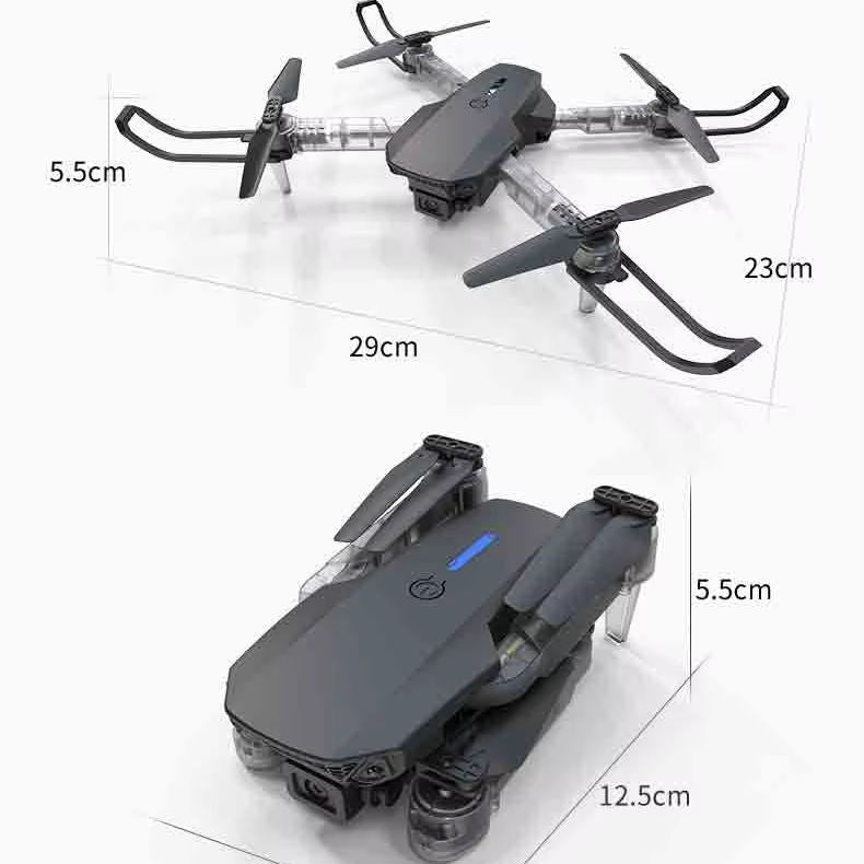Gray quadcopter drone with camera, foldable propellers, compact body